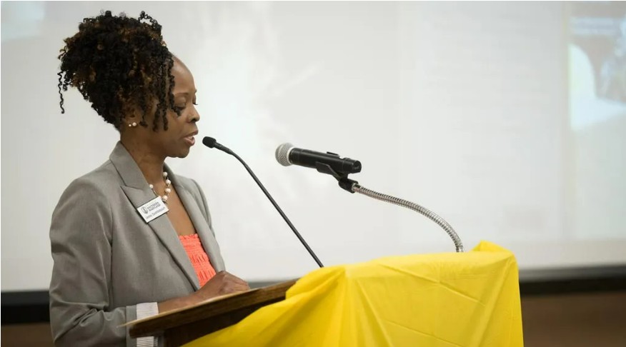 Lesley Quattlebaum, executive director of CSM's Velocity Center, welcomes guests to the exhibit's opening reception.