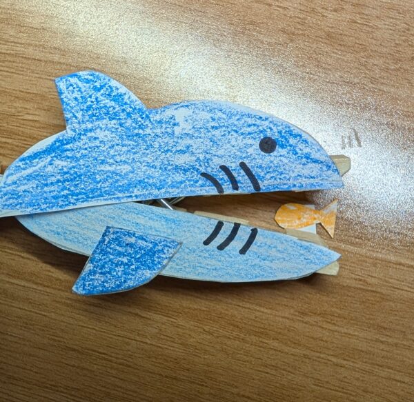 Bonus: Cut out a little fish and glue it to the inside of the clothespin!