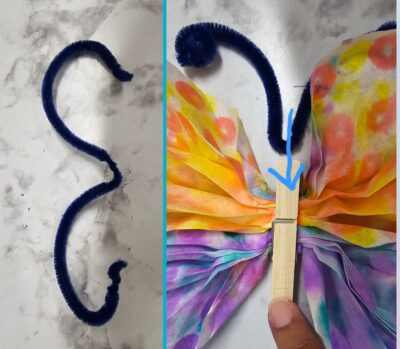Step Six: 6. Take your pipe cleaner and roll the ends like so. Open the laundry clip and place the “antenna” inside the opening of the clip. 