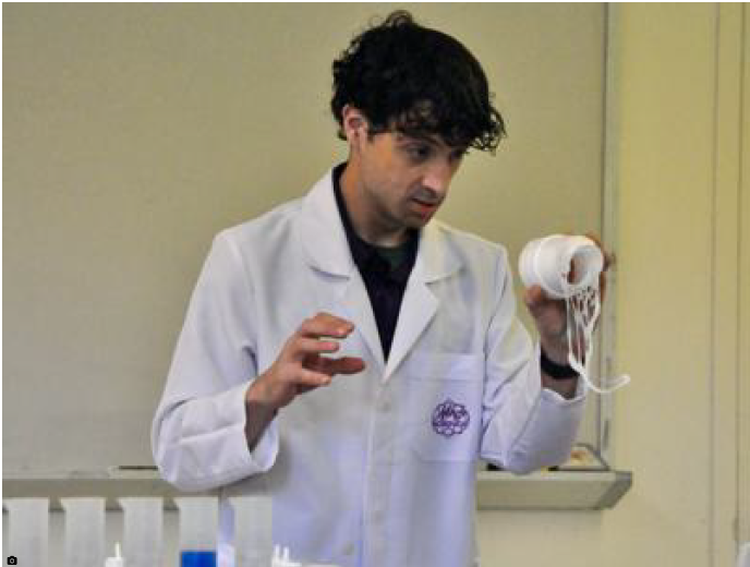 Mad Science Guy (also known as Tony Smith) looks at a disintegrating foam cup during a presentation July 3 at the Charles County Public Library.