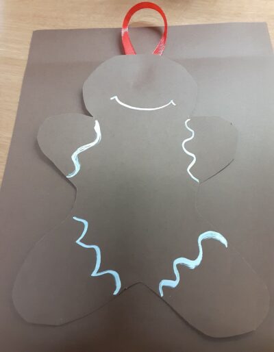 Glue on the ribbon hanger at the top