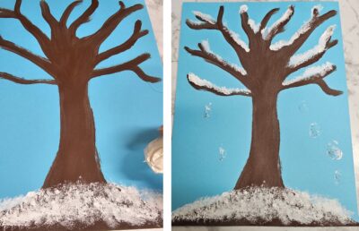 Dab the paper towel in white paint and start to dab the spots under the tree and on the branches to give it a snow effect. 