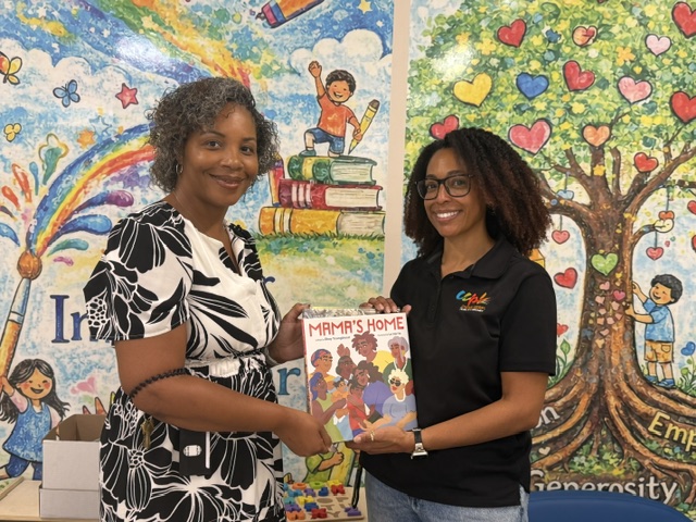  Dr. Tanisha Sanders, Director of the Charles County Department of Social Services (left), and Jennika Irvin, Youth Services Supervisor with Charles County Public Library (right), highlight a new partnership providing books for children and families visiting CCDSS. Photo credit: Charles County Public Library